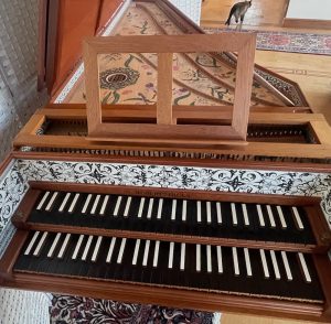 front view of harpsichord with music desk